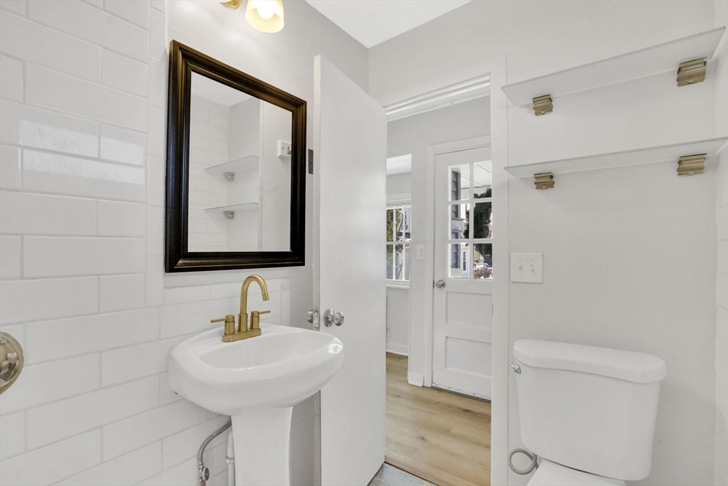 12 Stebbins Street Chicopee, MA 01020 - Photo 22 of 39 a bathroom with a sink a toilet and shower