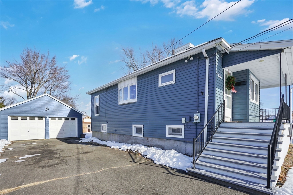 12 Stebbins Street Chicopee, MA 01020 - Photo 3 of 39 a front view of a house with a garage