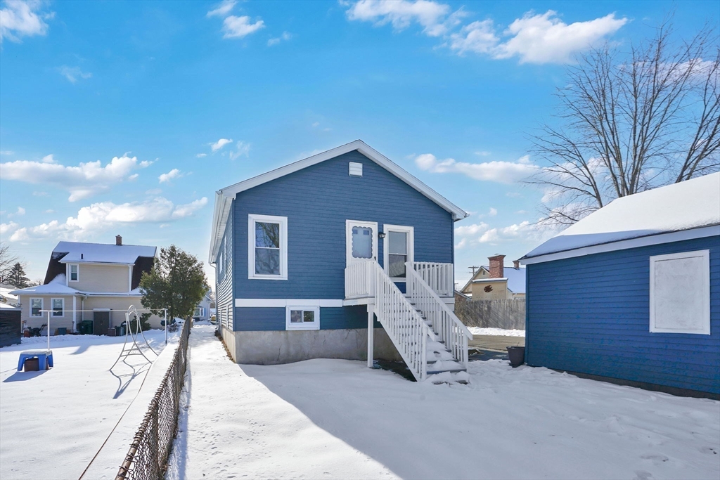 12 Stebbins Street Chicopee, MA 01020 - Photo 37 of 39 a front view of a house with a yard