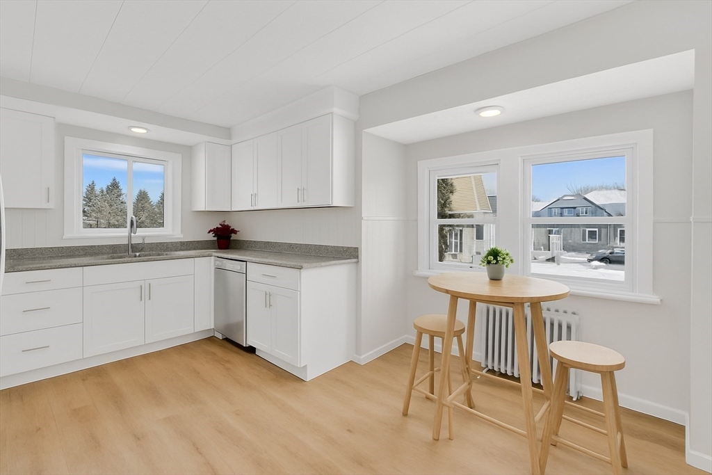 12 Stebbins Street Chicopee, MA 01020 - Photo 10 of 39 a kitchen with a sink cabinets and window