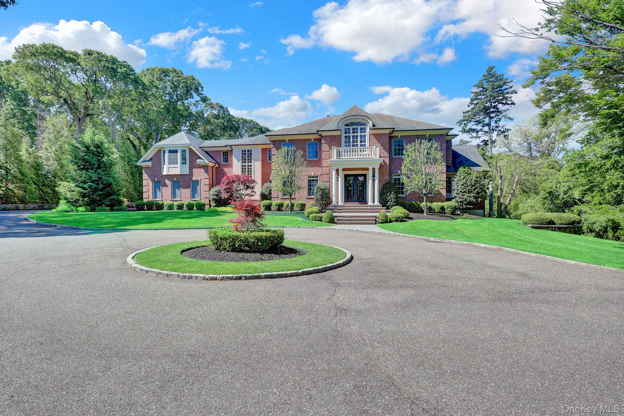 36 Old Field Road Setauket, NY 11733 - Photo 3 of 42 a front view of a house with a yard and trees