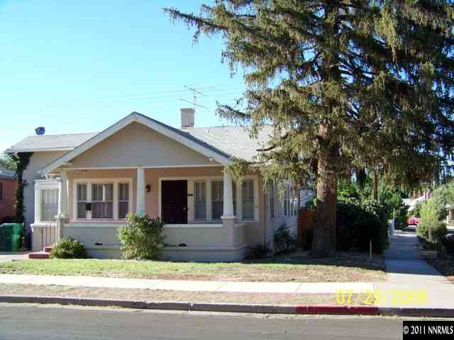 201 Caliente Street Reno, NV 89509 - Photo 1 of 5 a front view of a house with garage and yard