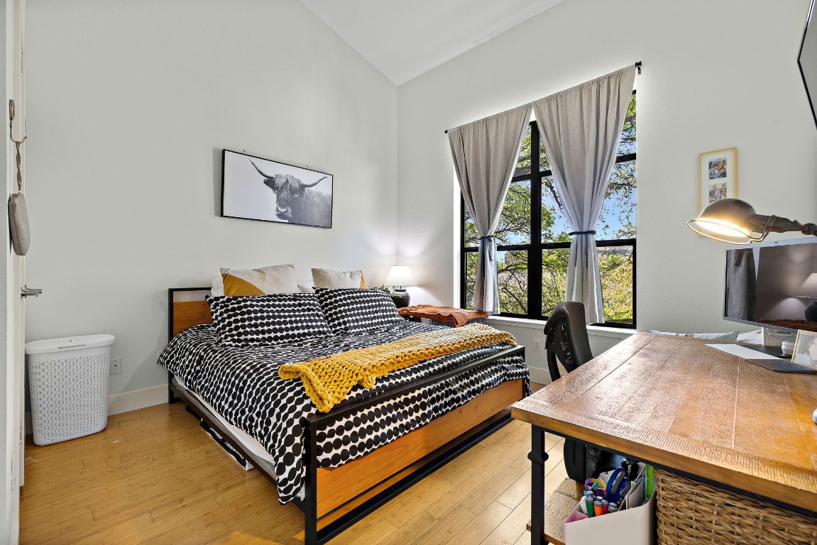 907 Duncan Lane, Unit 302 Austin, TX 78705 - Photo 15 of 24 a bedroom with a bed and window