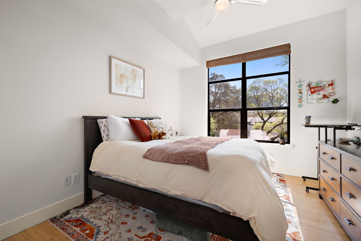 907 Duncan Lane, Unit 302 Austin, TX 78705 - Photo 16 of 24 a bedroom with a bed and a window