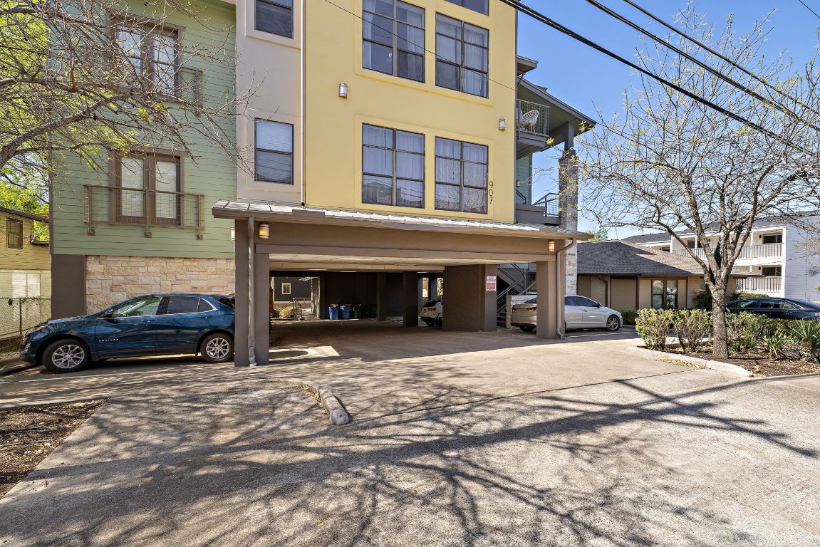 907 Duncan Lane, Unit 302 Austin, TX 78705 - Photo 2 of 24 a view of a car parked on the side of a street