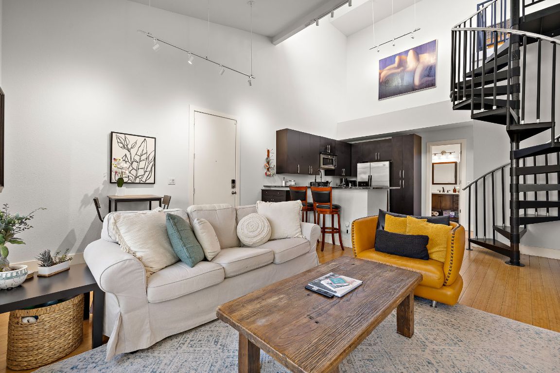 907 Duncan Lane, Unit 302 Austin, TX 78705 - Photo 3 of 24 a living room with furniture and a flat screen tv