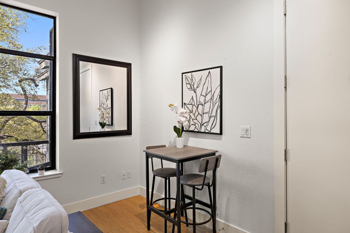 907 Duncan Lane, Unit 302 Austin, TX 78705 - Photo 8 of 24 a view of a livingroom with furniture and window