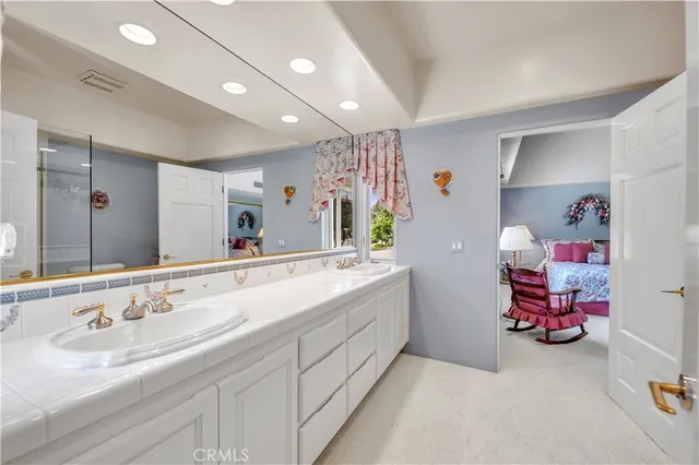 an aerial view of a house with a yard and lake view