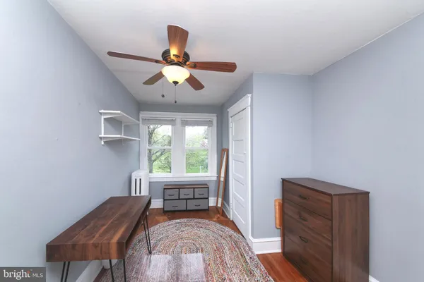 a view of a livingroom with furniture window and wooden floor