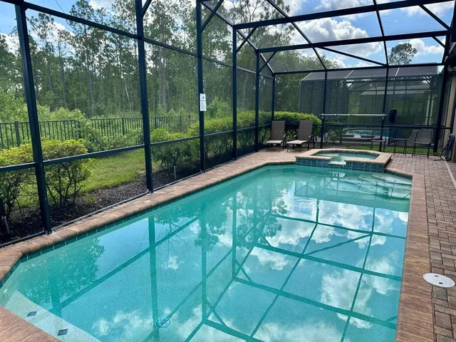 a view of a swimming pool with a patio