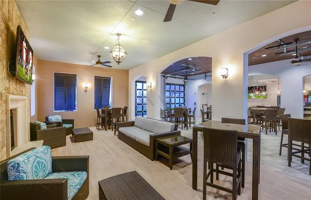 a living room with lots of furniture and a chandelier