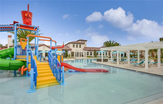 a view of a swimming pool with a lounge chairs