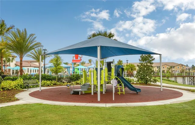 a view of a playground with a patio