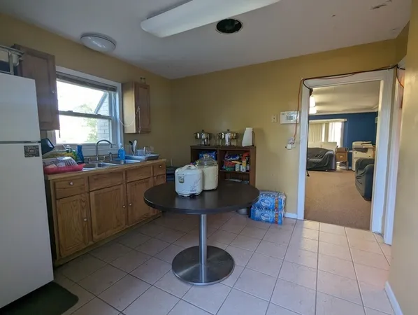 a kitchen with a sink and cabinets