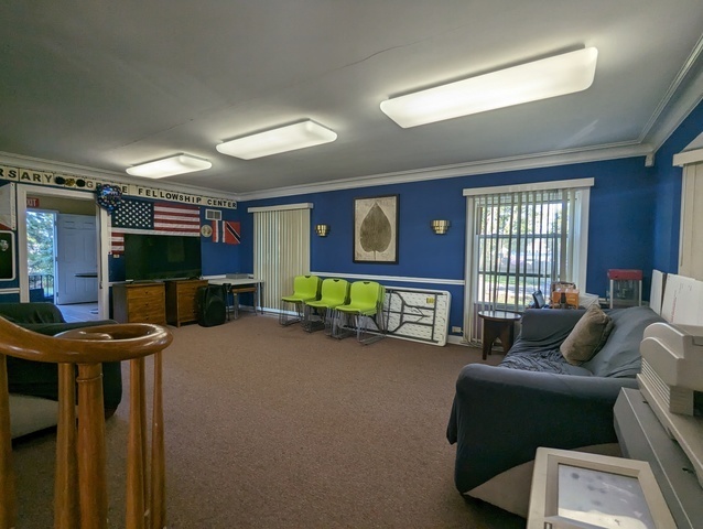 6950 Dempster Street Morton Grove, IL 60053 - Photo 16 of 21 a living room with furniture and a flat screen tv
