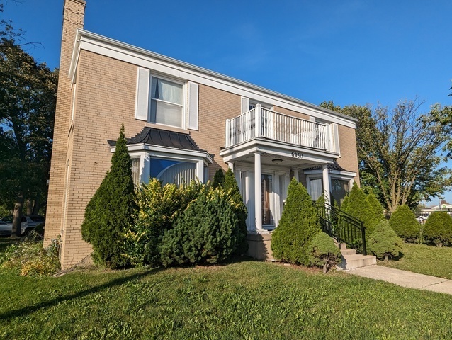 6950 Dempster Street Morton Grove, IL 60053 - Photo 4 of 21 a front view of a house with a yard