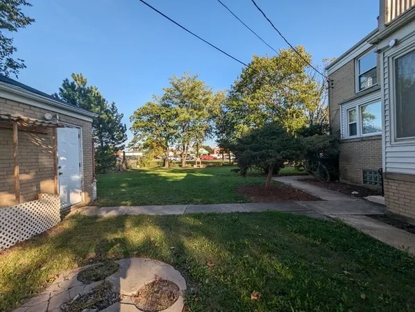 a view of backyard with outdoor space