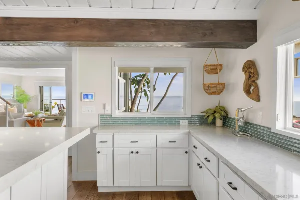 a kitchen with sink and cabinets