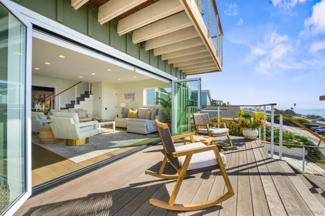 a living room with lots of furniture and a large window