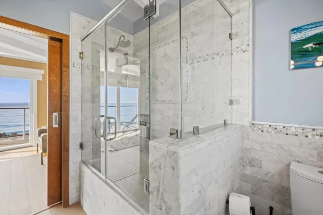 a bathroom with a bathtub and a shower