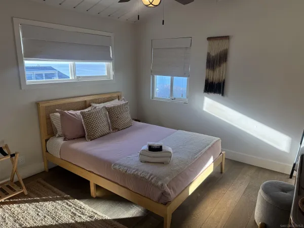 a bedroom with a bed and window