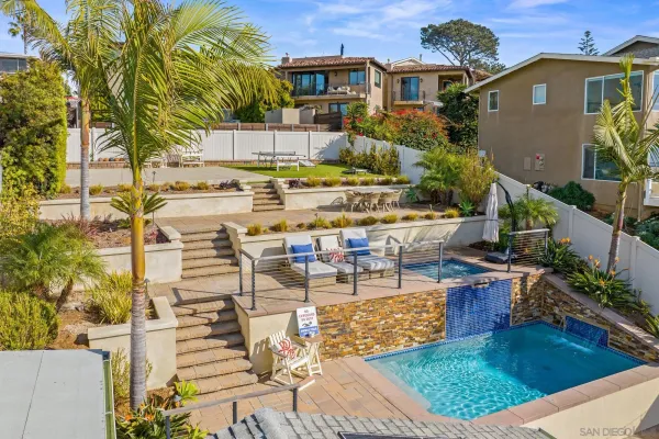 a view of a swimming pool with outdoor seating