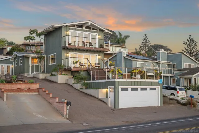 a view of a patio with table and chairs potted plants with wooden fence