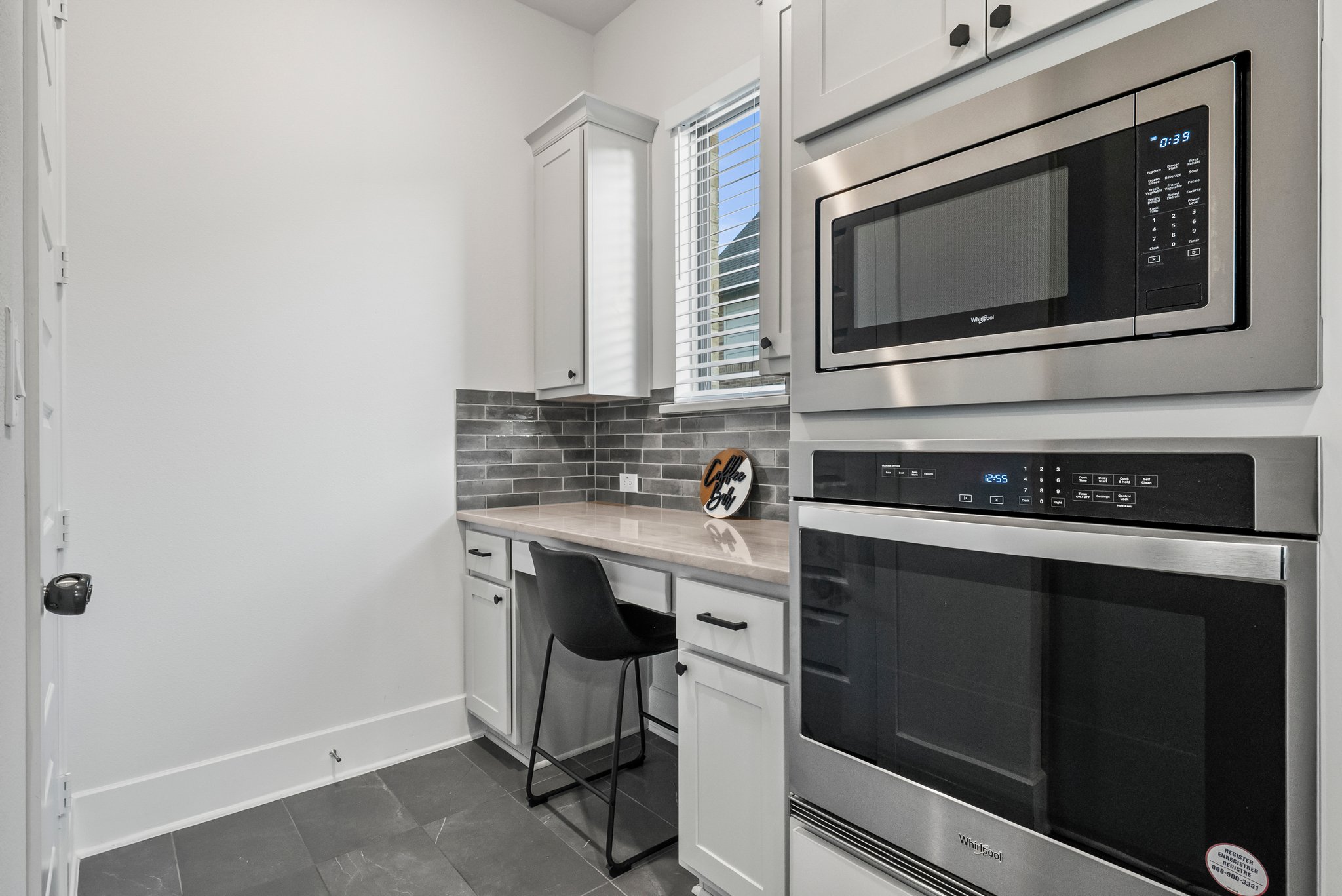 124 Low River Lane Georgetown, TX 78628 - Photo 11 of 39 a kitchen with stainless steel appliances a stove microwave and sink