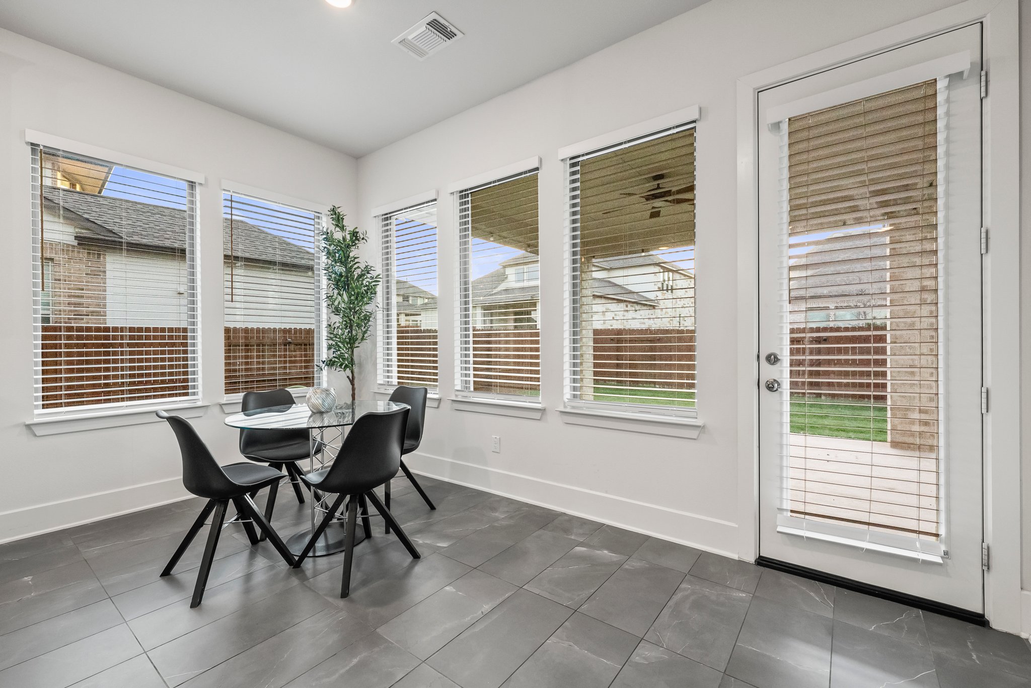 124 Low River Lane Georgetown, TX 78628 - Photo 13 of 39 a dining room with furniture and windows
