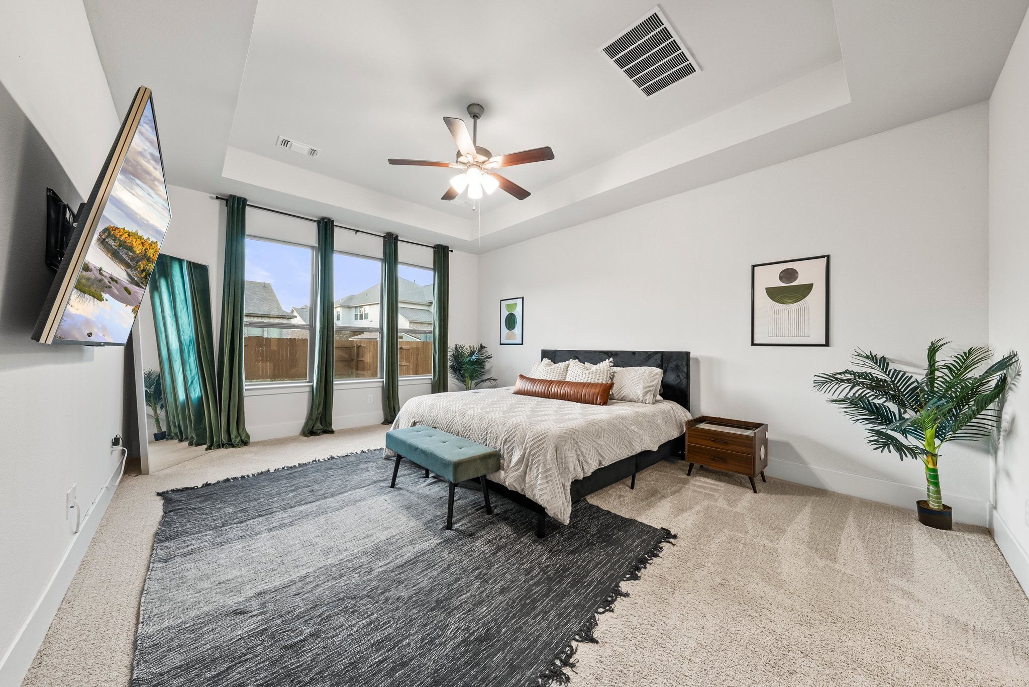124 Low River Lane Georgetown, TX 78628 - Photo 15 of 39 a spacious bedroom with a large bed and a chandelier