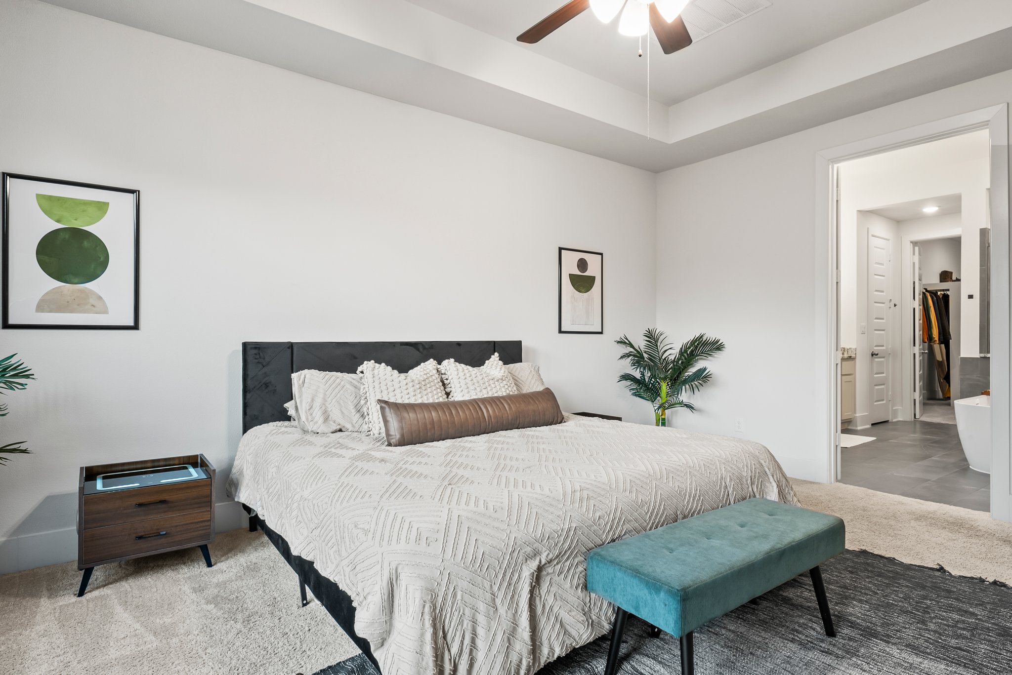 124 Low River Lane Georgetown, TX 78628 - Photo 16 of 39 a bedroom with a bed and a chandelier