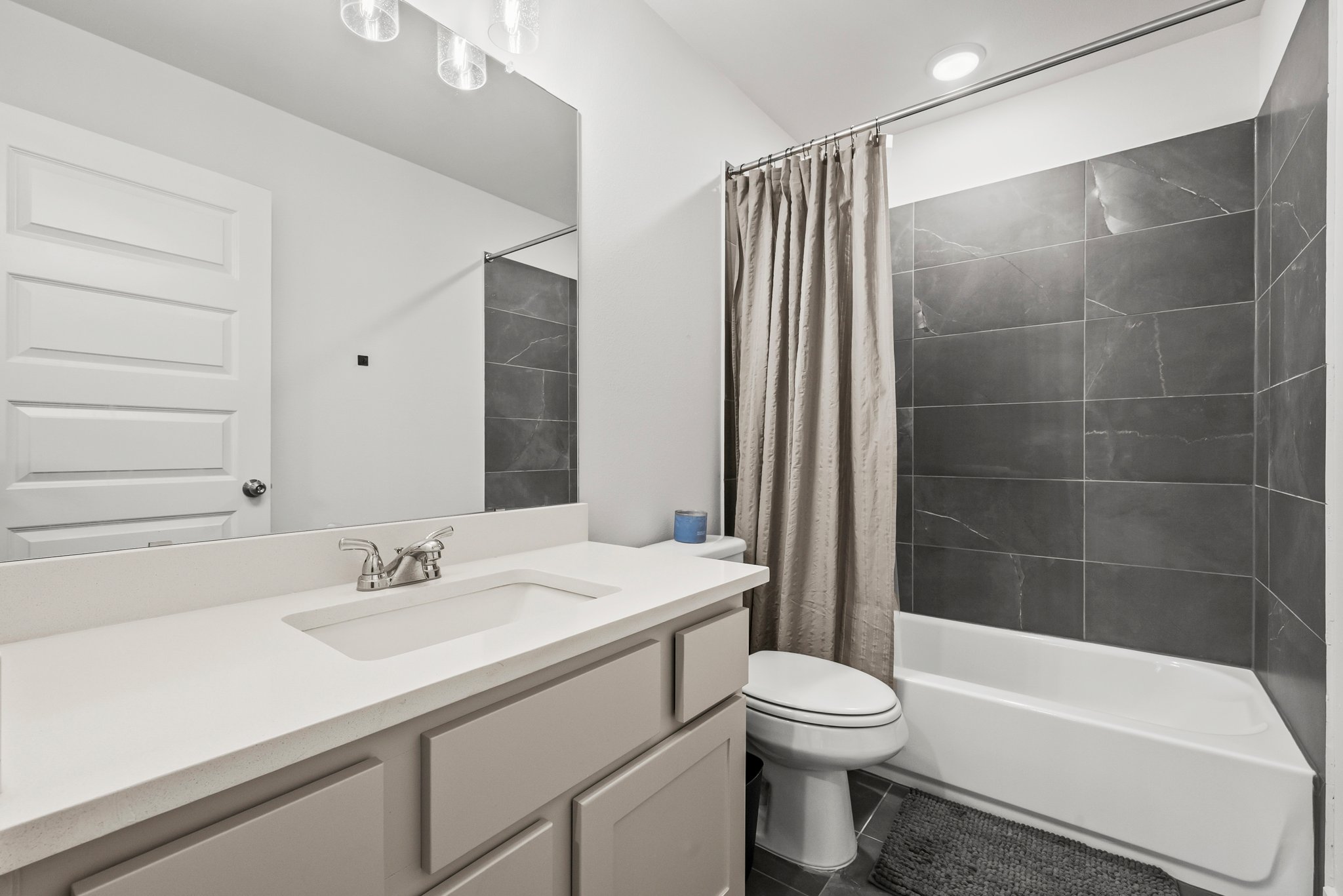 124 Low River Lane Georgetown, TX 78628 - Photo 29 of 39 a bathroom with a sink a toilet and shower