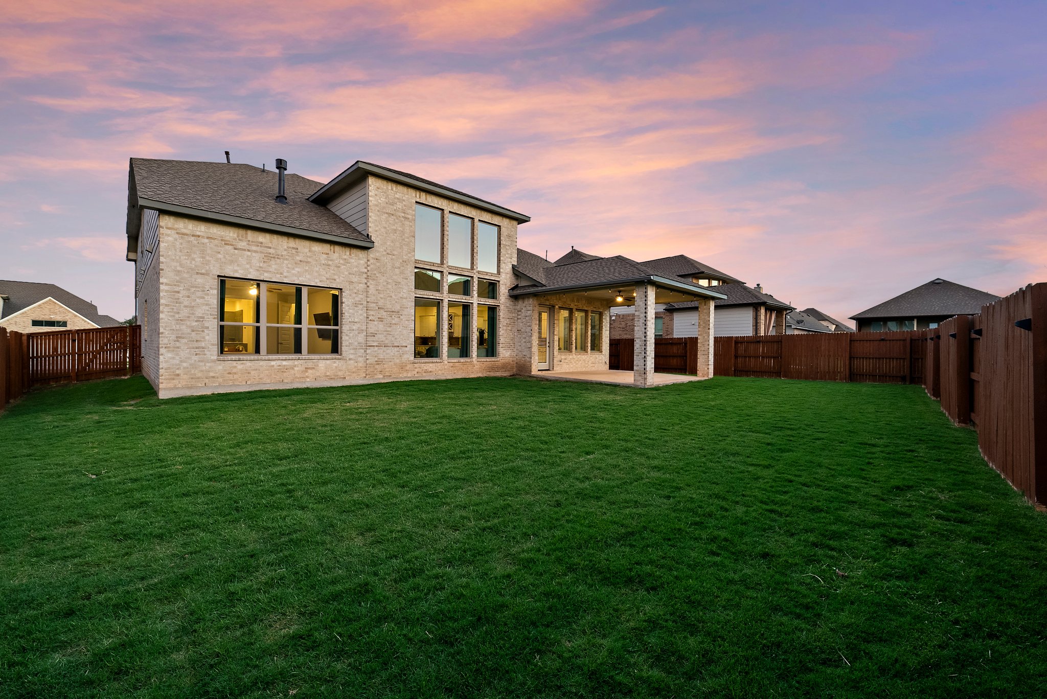 124 Low River Lane Georgetown, TX 78628 - Photo 35 of 39 a front view of a house with a garden and yard