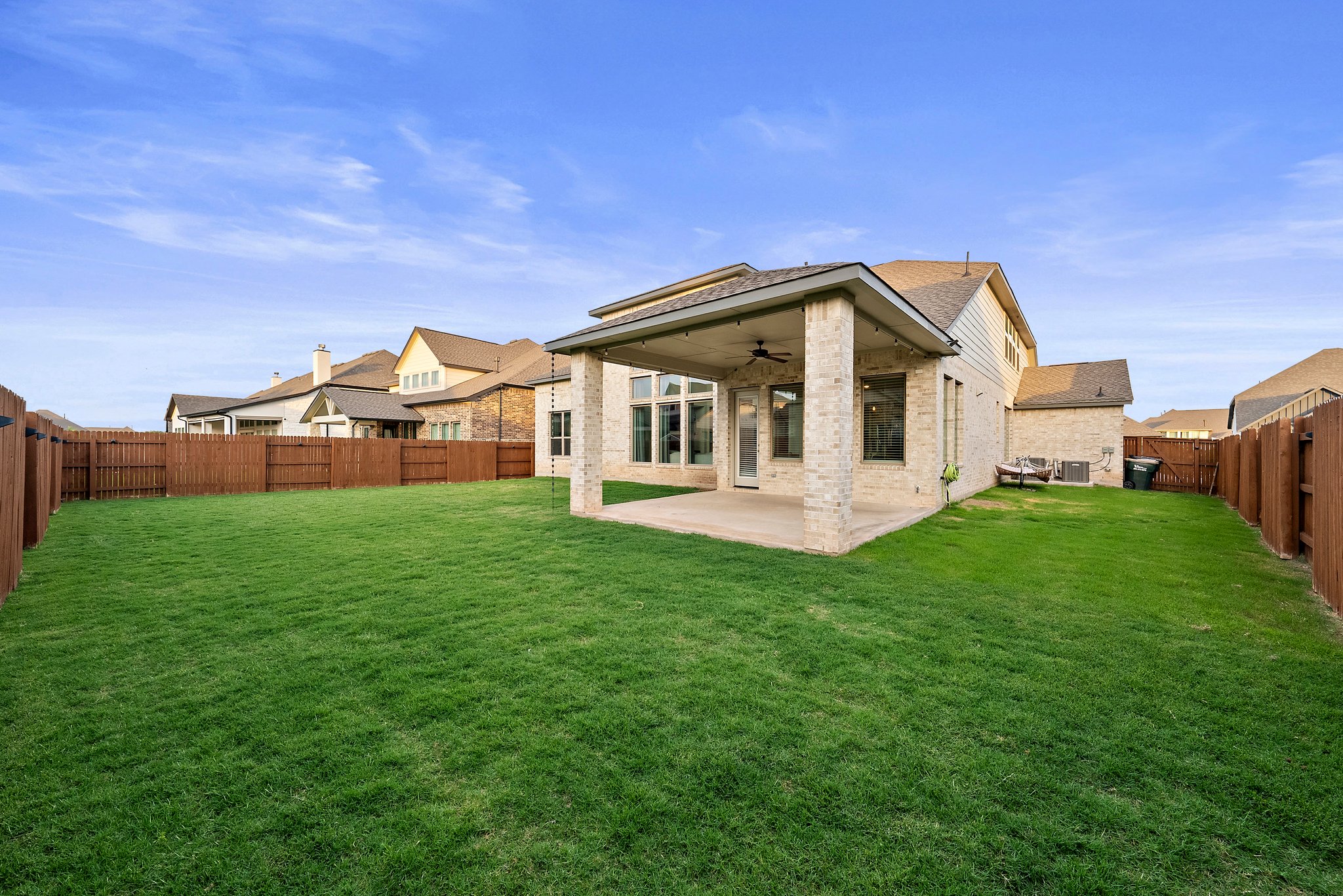 124 Low River Lane Georgetown, TX 78628 - Photo 36 of 39 a view of a house with backyard porch and garden