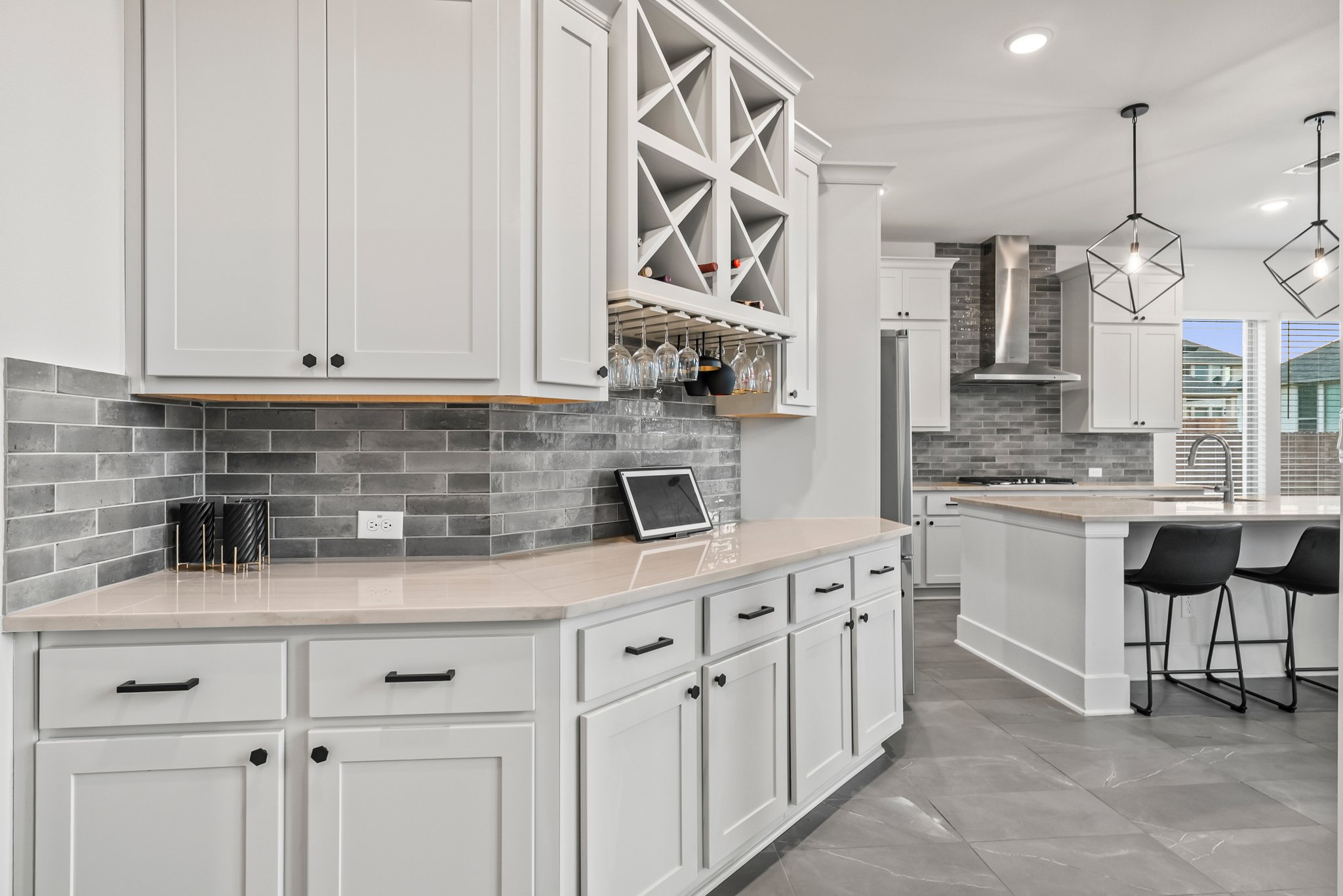 124 Low River Lane Georgetown, TX 78628 - Photo 8 of 39 a kitchen with white cabinets and white appliances