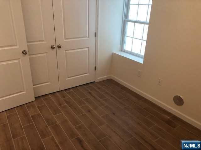 426 Jersey Street, Unit 1 GROUND Harrison, NJ 07029 - Photo 16 of 17 a view of an empty room with a window