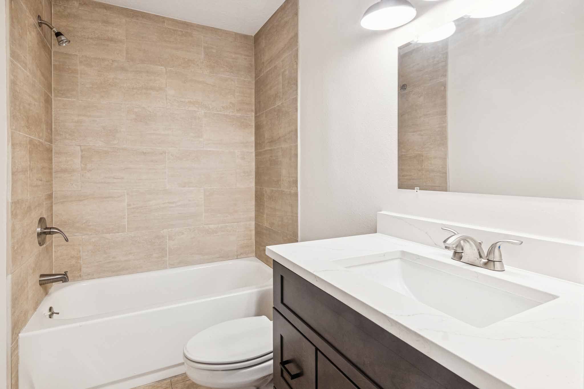 305 James Street Winnie, TX 77665 - Photo 13 of 25 a bathroom with a sink a toilet and a bathtub