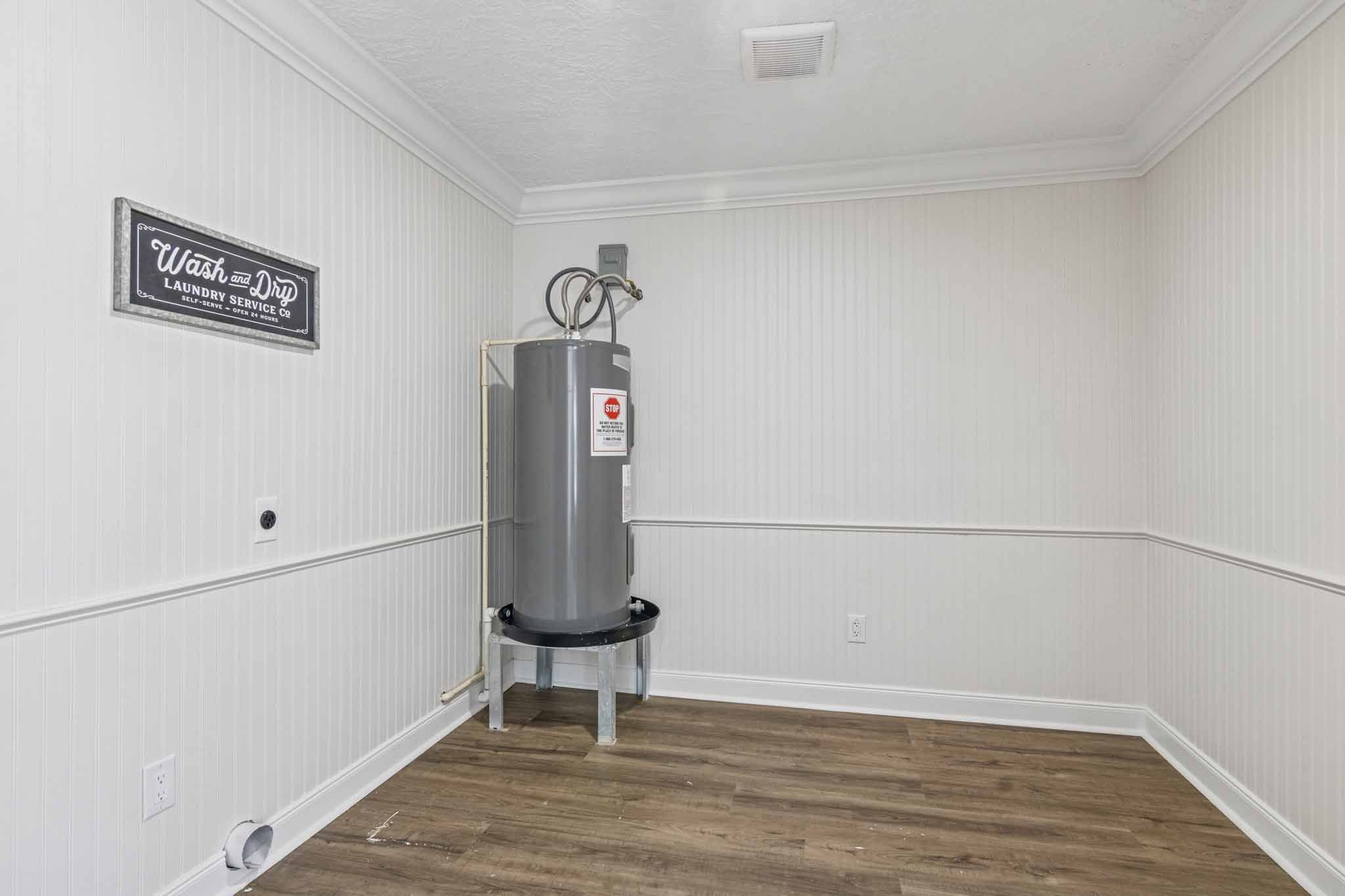 305 James Street Winnie, TX 77665 - Photo 18 of 25 a view of storage and utility room with wooden floor
