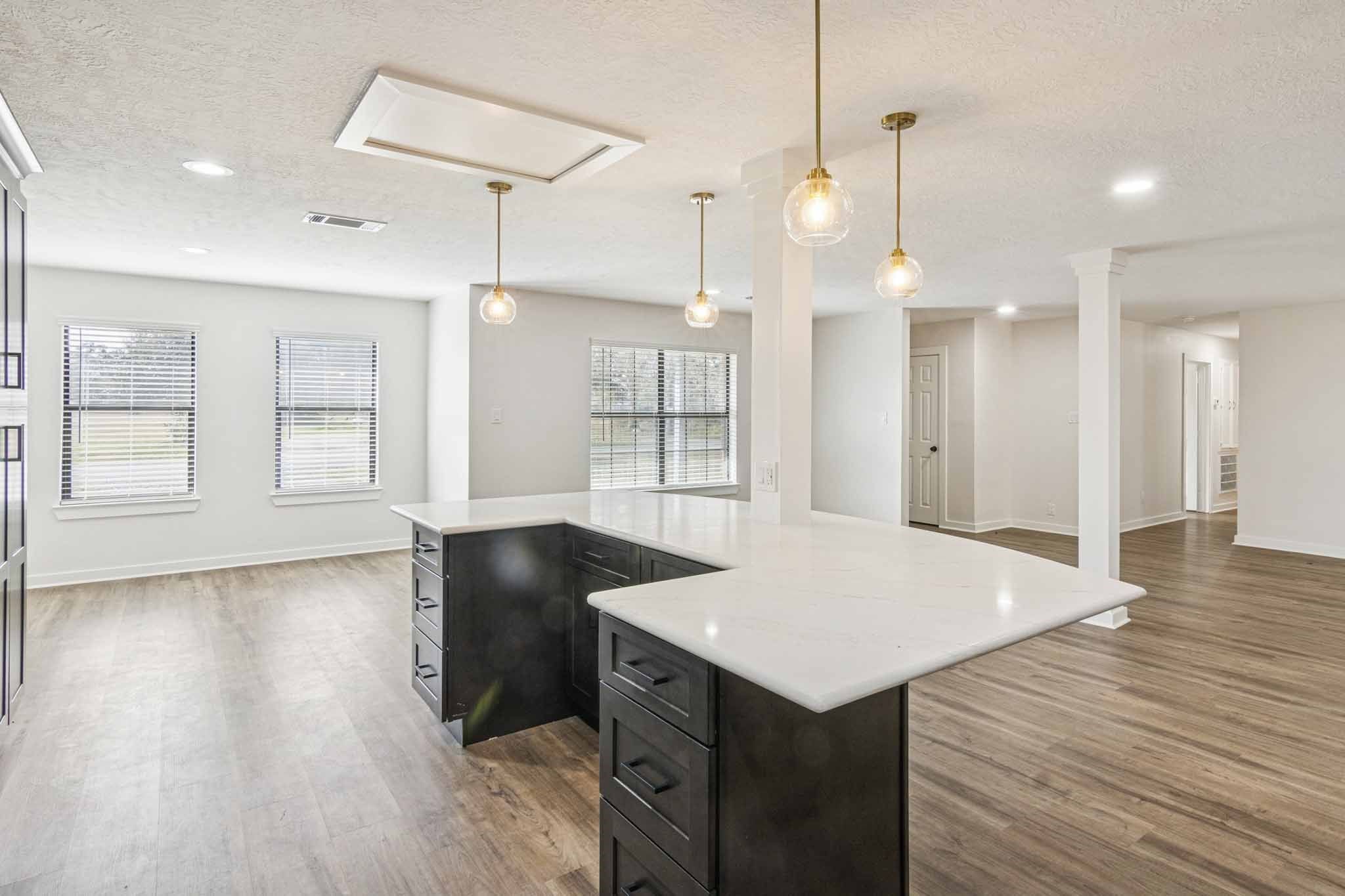 305 James Street Winnie, TX 77665 - Photo 4 of 25 a kitchen with a wooden floor and window