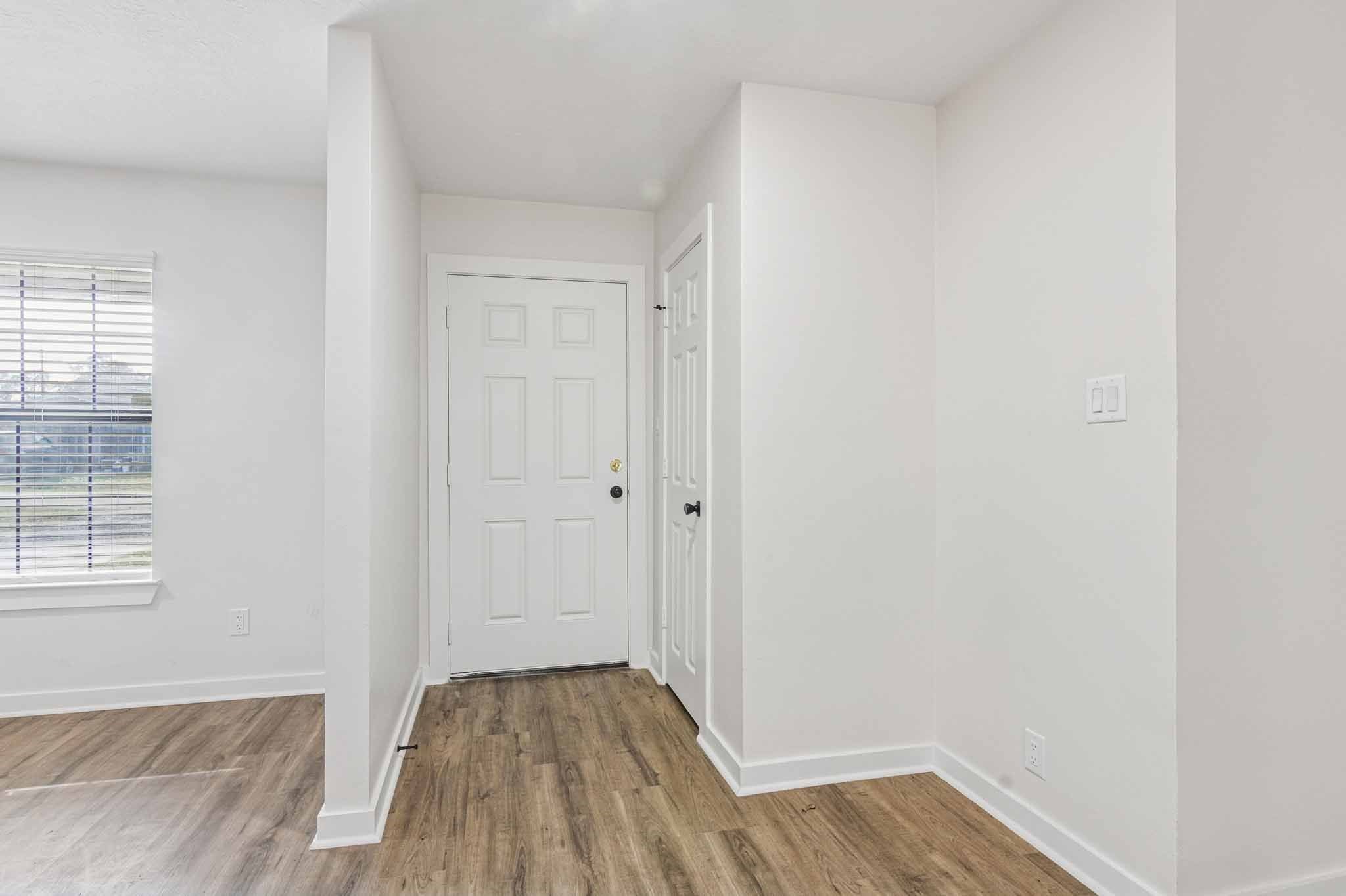 305 James Street Winnie, TX 77665 - Photo 5 of 25 a view of a room with wooden floor and window
