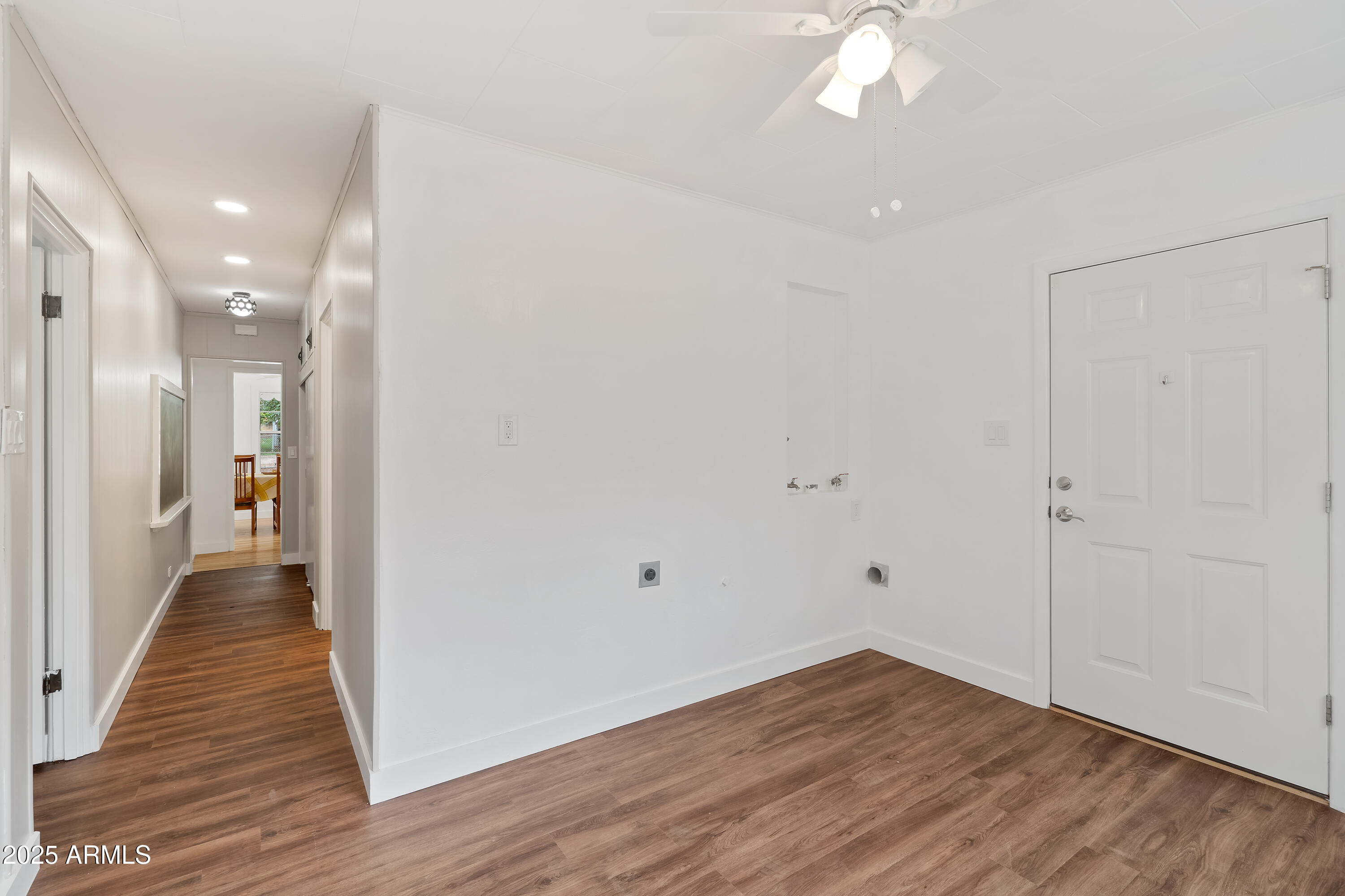 606 Oliver Circle Bisbee, AZ 85603 - Photo 15 of 30 a view of a hallway with wooden floor