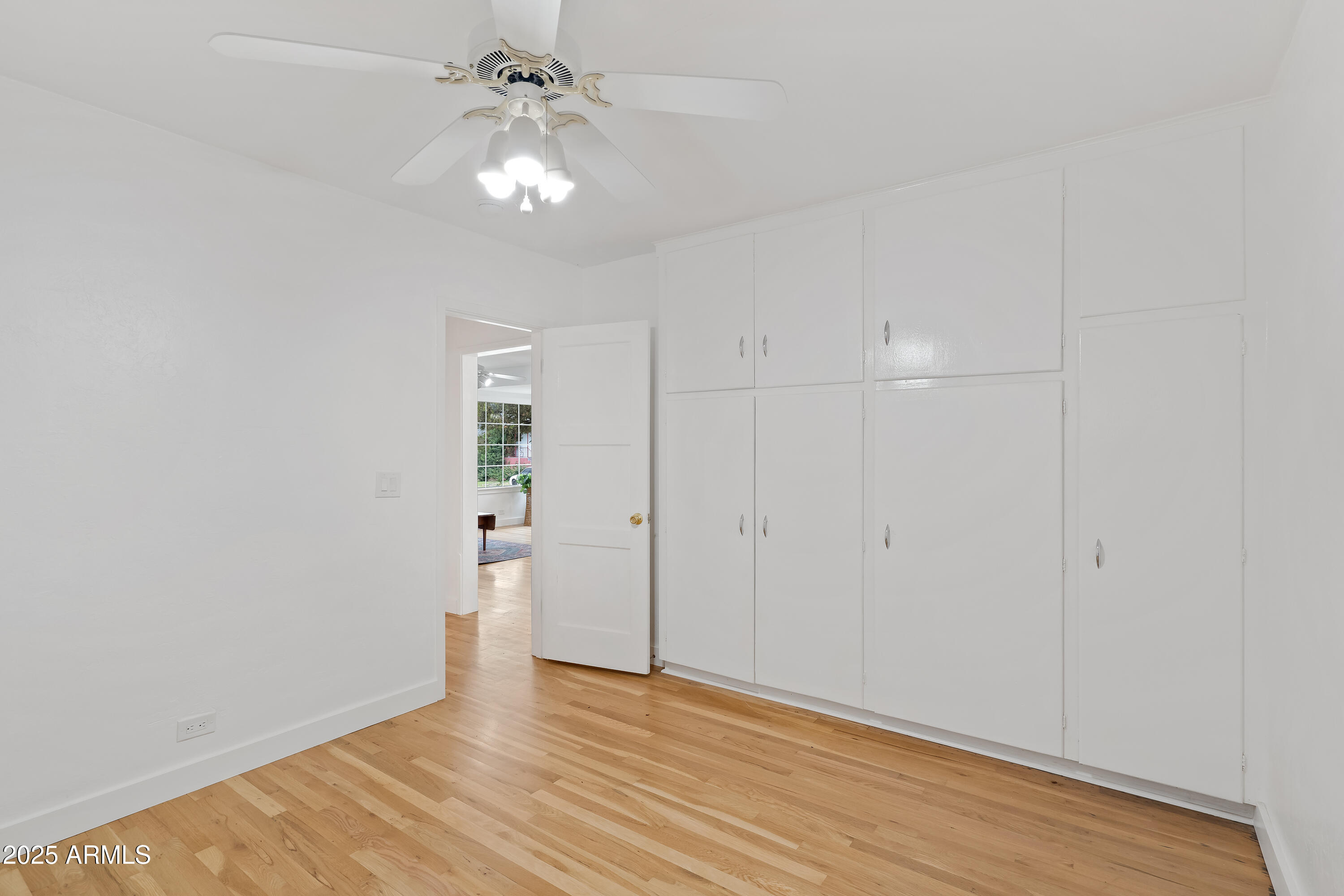 606 Oliver Circle Bisbee, AZ 85603 - Photo 17 of 30 wooden floor in an empty room with a window