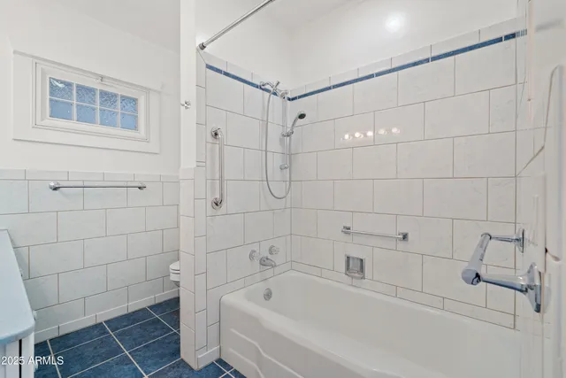 a kitchen with white cabinets and a sink