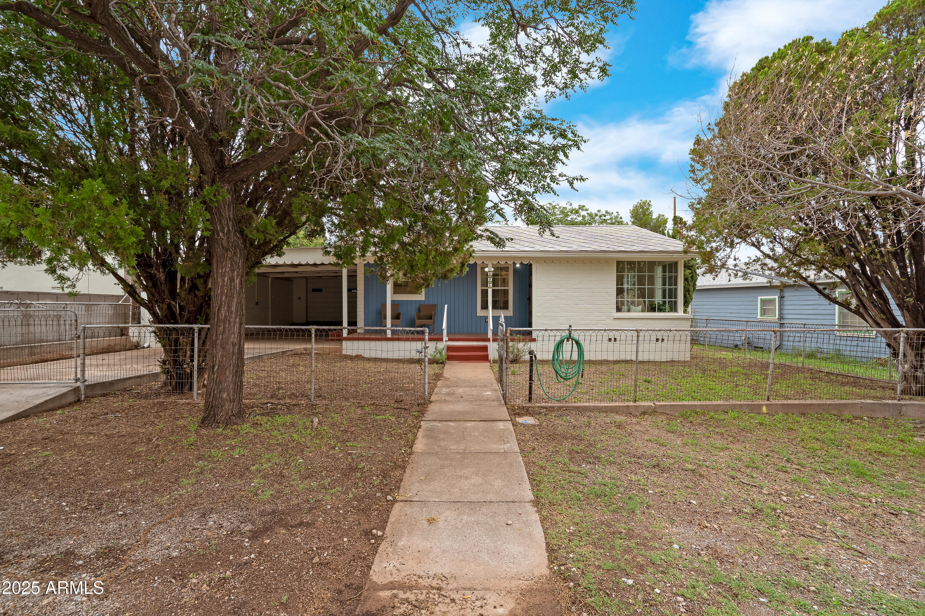 606 Oliver Circle Bisbee, AZ 85603 - Photo 22 of 30 a front view of a house with a yard