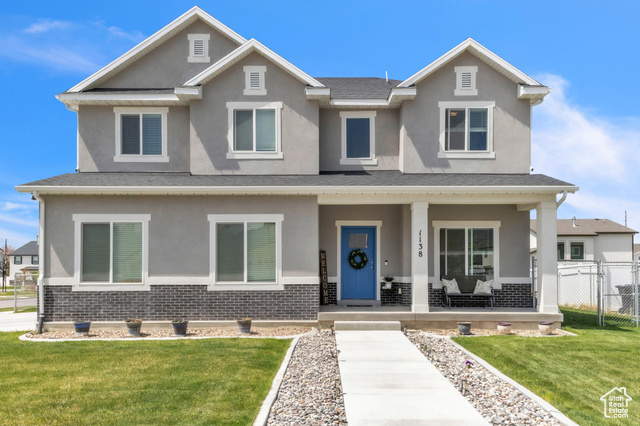 1138 South 1400th Street West Springville, UT 84663 - Photo 1 of 1 Craftsman house featuring covered porch, brick siding, fence, and stucco siding