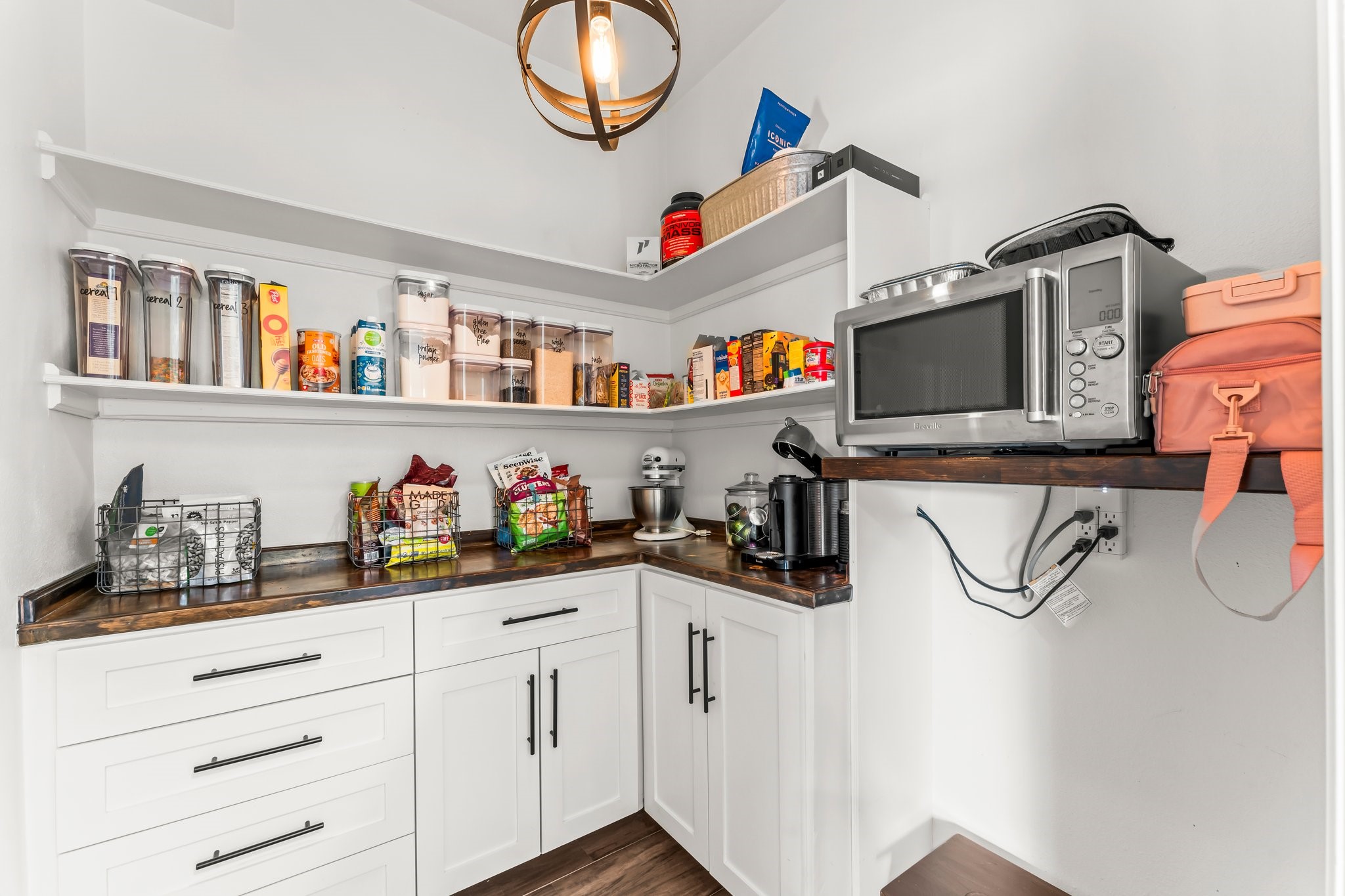3126 Burton Ridge Drive Spring, TX 77386 - Photo 13 of 41 Walk-in pantry with built-in shelving, cabinetry, and ample storage for small appliances and pantry items.
