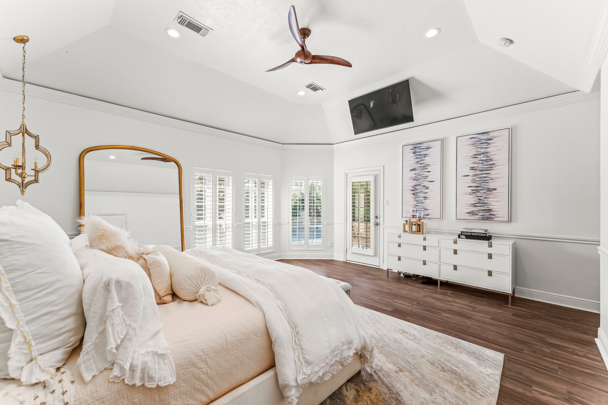 3126 Burton Ridge Drive Spring, TX 77386 - Photo 15 of 41 a spacious bedroom with a large bed and wooden floor