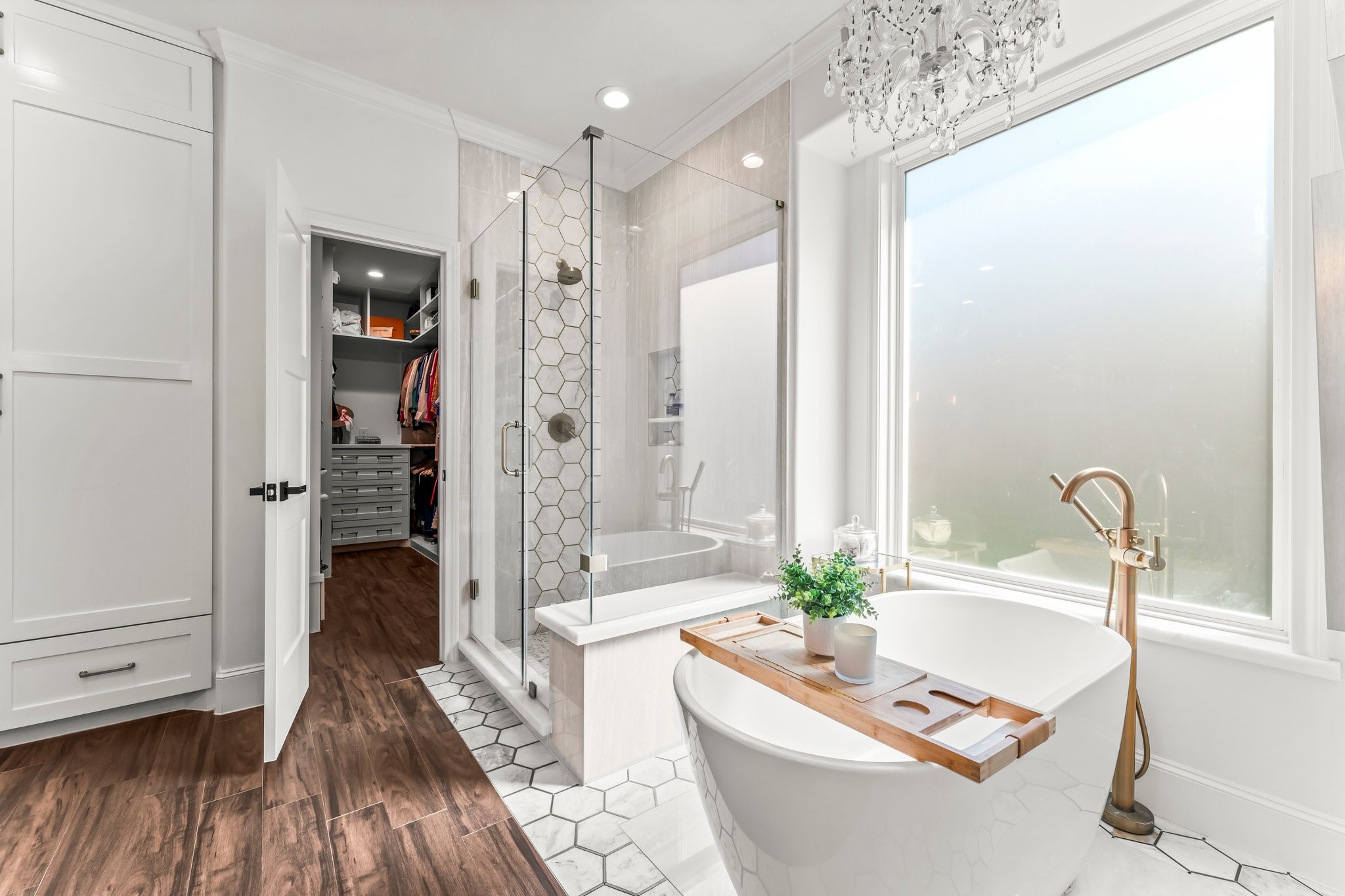 3126 Burton Ridge Drive Spring, TX 77386 - Photo 17 of 41 Primary bath featuring a walk-in closet, soaking tub, and separate standing shower, offering a relaxing and well-designed retreat.