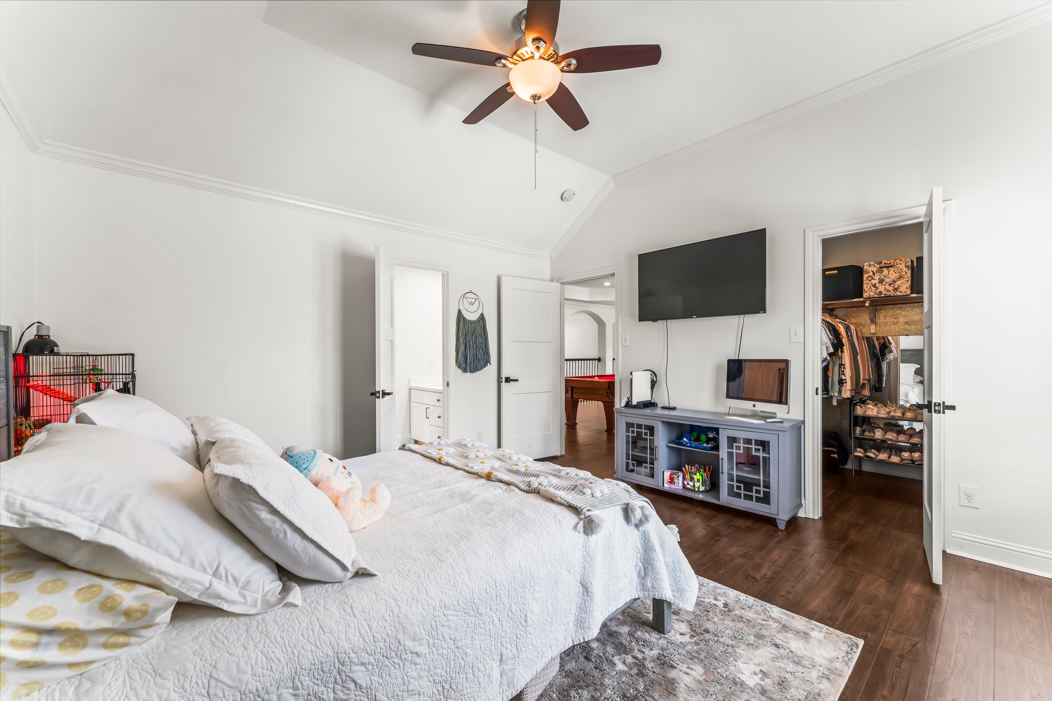 3126 Burton Ridge Drive Spring, TX 77386 - Photo 24 of 41 a bedroom with a bed and a flat tv screen on dresser