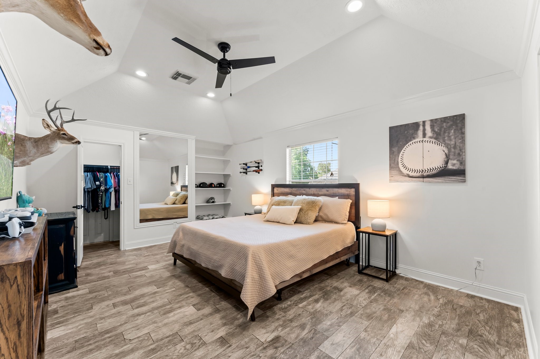 3126 Burton Ridge Drive Spring, TX 77386 - Photo 29 of 41 a bedroom with a bed and a chandelier